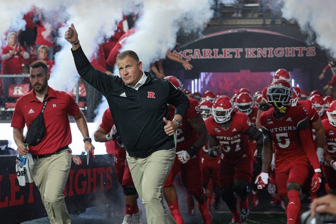 Sep 24, 2022; Piscataway, New Jersey, USA; Rutgers Scarlet Knights head coach Greg Schiano leads the Scarlet Knights football team onto the field before a game against the Iowa Hawkeyes at SHI Stadium. Mandatory Credit: Vincent Carchietta-USA TODAY Sports