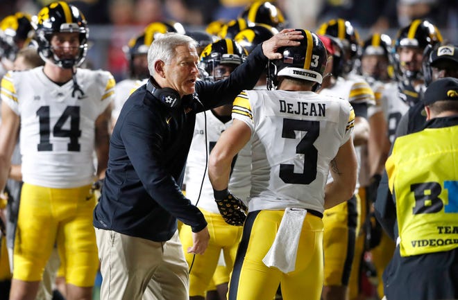 Iowa head coach Kirk Ferentz congratulates Iowa defensive back Cooper DeJean (3) after scoring a touchdown against Rutgers during the first half of an NCAA football game, Saturday, Sept. 24, 2022, in Piscataway, N.J.