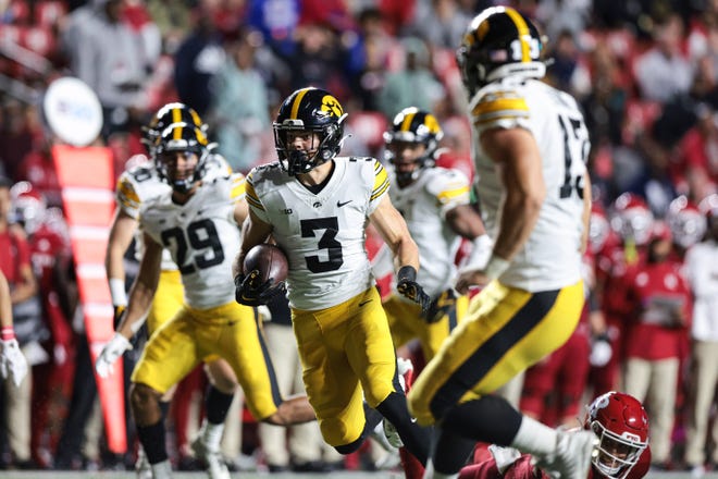 Iowa  defensive back Cooper DeJean (3) returns an interception for a touchdown during the first half against Rutgers on Saturday, Sept. 24, 2022 in Piscataway, New Jersey.