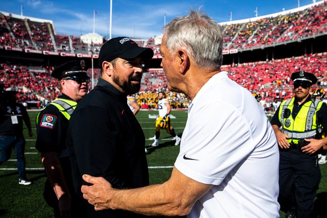 Ohio State head coach Ryan Day, left, shakes hands with Iowa head coach Kirk Ferentz after a NCAA football game, Saturday, Oct. 22, 2022, at Ohio Stadium in Columbus, Ohio.