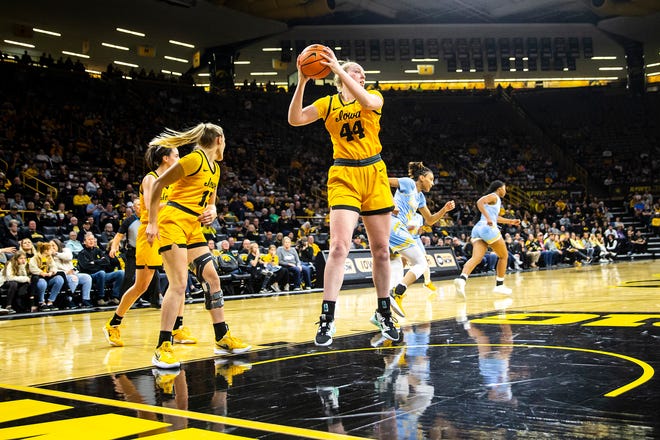 Iowa center Addison O'Grady (44) pulls down a rebound during a NCAA women's basketball game against Southern University, Monday, Nov. 7, 2022, at Carver-Hawkeye Arena in Iowa City, Iowa.