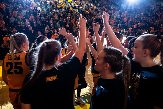 Iowa Hawkeyes players huddle up as they are introduced before a NCAA women's basketball game against Southern University, Monday, Nov. 7, 2022, at Carver-Hawkeye Arena in Iowa City, Iowa.