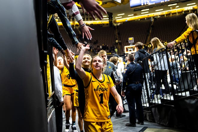 Iowa guard Molly Davis (1) high-fives fans after a NCAA women's basketball game against Southern University, Monday, Nov. 7, 2022, at Carver-Hawkeye Arena in Iowa City, Iowa.