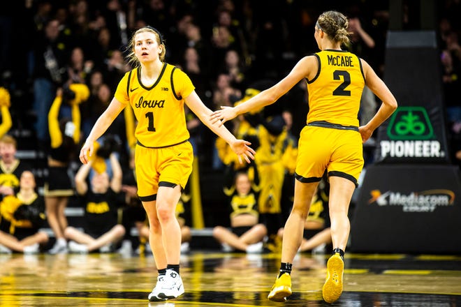 Iowa guard Molly Davis, left, gets a high-five from Taylor McCabe after making a 3-point basket during a NCAA women's basketball game against Southern University, Monday, Nov. 7, 2022, at Carver-Hawkeye Arena in Iowa City, Iowa.