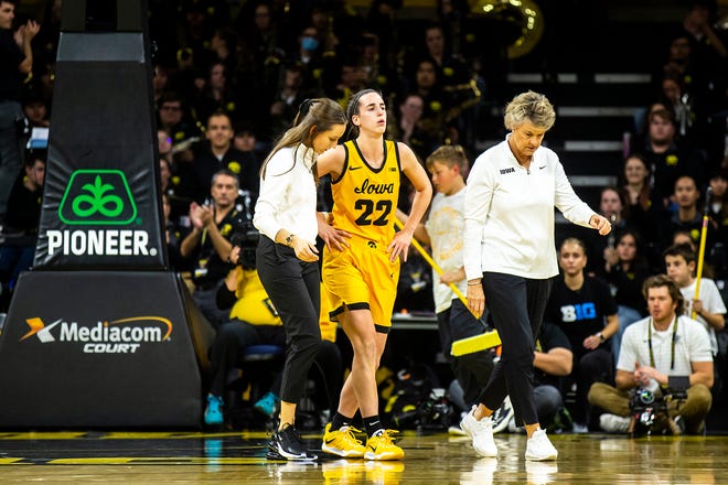 Iowa guard Caitlin Clark (22) walks off the court with Iowa head coach Lisa Bluder, right, during a NCAA women's basketball game against Southern University, Monday, Nov. 7, 2022, at Carver-Hawkeye Arena in Iowa City, Iowa.