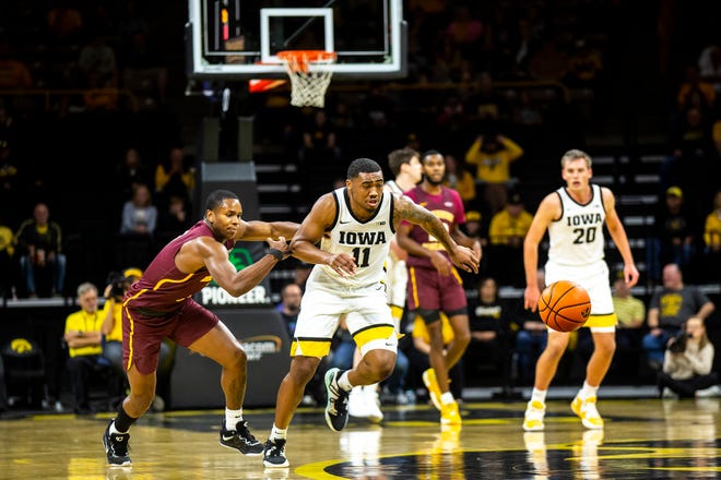 Iowa guard Tony Perkins (11) gets a steal from Bethune-Cookman guard Marcus Garrett, left, during a NCAA men's basketball game, Monday, Nov. 7, 2022, at Carver-Hawkeye Arena in Iowa City, Iowa.
