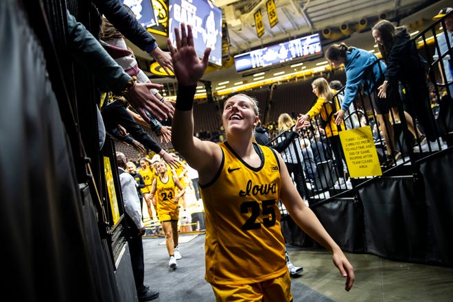 Iowa center Monika Czinano (25) high-fives fans after a NCAA women's basketball game against Southern University, Monday, Nov. 7, 2022, at Carver-Hawkeye Arena in Iowa City, Iowa.