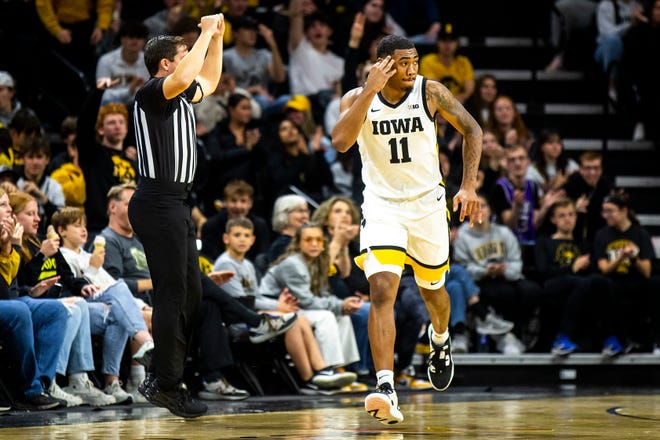 Iowa guard Tony Perkins (11) reacts after making a 3-point basket during a NCAA men's basketball game against Bethune-Cookman, Monday, Nov. 7, 2022, at Carver-Hawkeye Arena in Iowa City, Iowa.