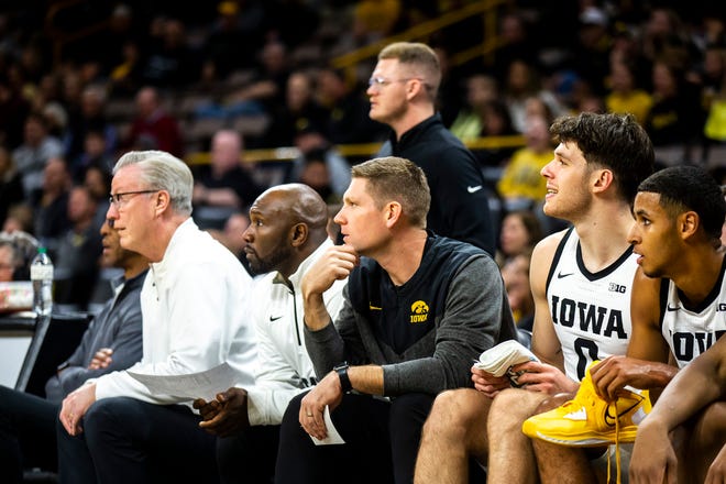 Iowa head coach Fran McCaffery, left, Iowa assistant coach Courtney Eldridge and Iowa assistant coach Matt Gatens sit on the bench with players Filip Rebraca (0) and Kris Murray during a NCAA men's basketball game against Bethune-Cookman, Monday, Nov. 7, 2022, at Carver-Hawkeye Arena in Iowa City, Iowa.
