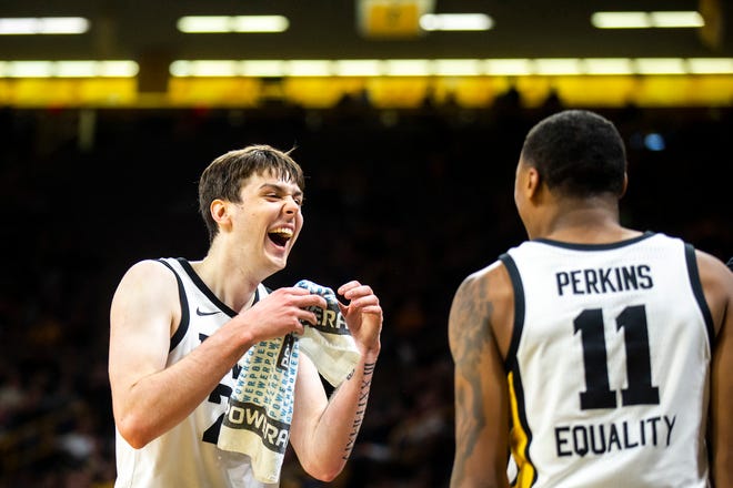 Iowa forward Patrick McCaffery, left, laughs with guard Tony Perkins during a NCAA men's basketball game against Bethune-Cookman, Monday, Nov. 7, 2022, at Carver-Hawkeye Arena in Iowa City, Iowa.