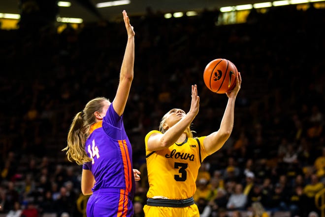 Iowa guard Sydney Affolter (3) shoots a basket as Evansville's Abby Feit (14) defends during a NCAA women's basketball game, Thursday, Nov. 10, 2022, at Carver-Hawkeye Arena in Iowa City, Iowa.