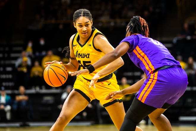 Iowa forward Hannah Stuelke, left, drives to the basket as Evansville guard Myia Clark defends during a NCAA women's basketball game, Thursday, Nov. 10, 2022, at Carver-Hawkeye Arena in Iowa City, Iowa.