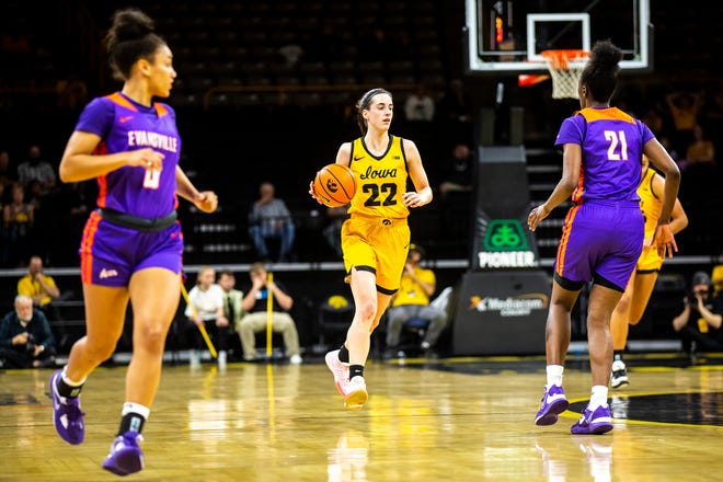Iowa guard Caitlin Clark (22) dribbles the ball up court during a NCAA women's basketball game against Evansville, Thursday, Nov. 10, 2022, at Carver-Hawkeye Arena in Iowa City, Iowa.