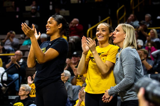 Iowa forward Jada Gyamfi, left, and guard Kylie Feuerbach cheer on teammates during a NCAA women's basketball game against Evansville, Thursday, Nov. 10, 2022, at Carver-Hawkeye Arena in Iowa City, Iowa.