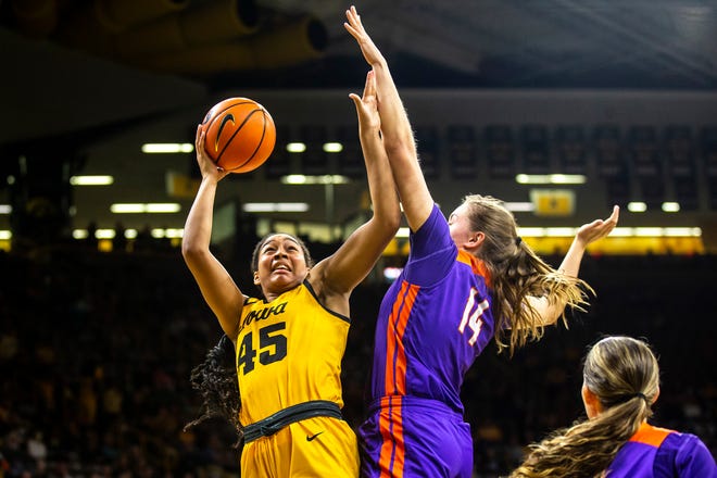 Iowa forward Hannah Stuelke (45) shoots the ball as Evansville's Abby Feit (14) defends during a NCAA women's basketball game, Thursday, Nov. 10, 2022, at Carver-Hawkeye Arena in Iowa City, Iowa.