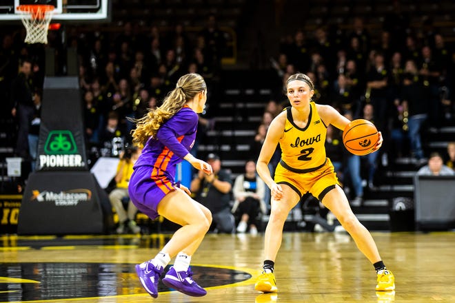 Iowa guard Taylor McCabe dribbles the ball as Evansville guard Anna Newman, left, defends during a NCAA women's basketball game, Thursday, Nov. 10, 2022, at Carver-Hawkeye Arena in Iowa City, Iowa.