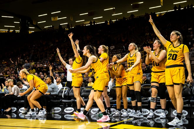 Iowa guard Caitlin Clark celebrates with teammates on the bench during a NCAA women's basketball game against Evansville, Thursday, Nov. 10, 2022, at Carver-Hawkeye Arena in Iowa City, Iowa.