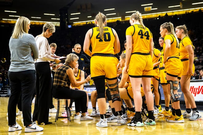 Iowa head coach Lisa Bluder talks with players in a timeout during a NCAA women's basketball game against Evansville, Thursday, Nov. 10, 2022, at Carver-Hawkeye Arena in Iowa City, Iowa.