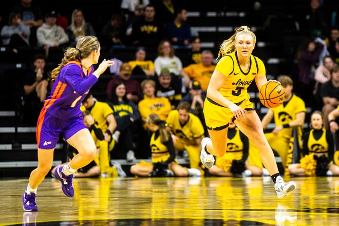 Iowa guard Sydney Affolter (3) dribbles the ball as Evansville guard Anna Newman defends during a NCAA women's basketball game, Thursday, Nov. 10, 2022, at Carver-Hawkeye Arena in Iowa City, Iowa.
