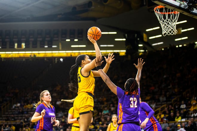 Iowa forward Hannah Stuelke drives to the basket as Evansville guard Myia Clark (32) defends during a NCAA women's basketball game, Thursday, Nov. 10, 2022, at Carver-Hawkeye Arena in Iowa City, Iowa.