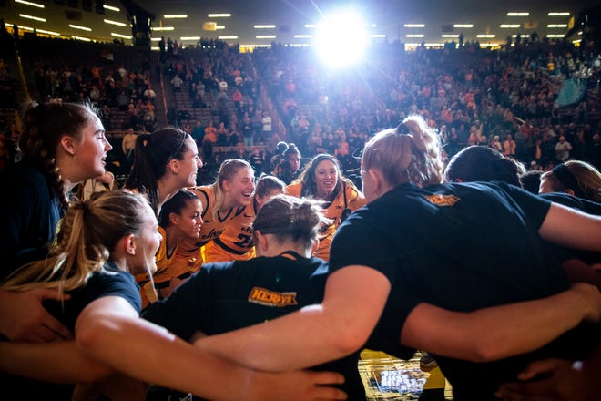 Iowa Hawkeyes players, from left, AJ Ediger, Caitlin Clark, Gabbie Marshall, Monika Czinano, Kate Martin and McKenna Warnock huddle up with teammates before a NCAA women's basketball game against Evansville, Thursday, Nov. 10, 2022, at Carver-Hawkeye Arena in Iowa City, Iowa.