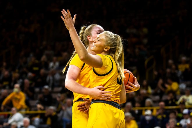Iowa guard Sydney Affolter, right, reacts with Sharon Goodman after drawing a foul during a NCAA women's basketball game against Evansville, Thursday, Nov. 10, 2022, at Carver-Hawkeye Arena in Iowa City, Iowa.