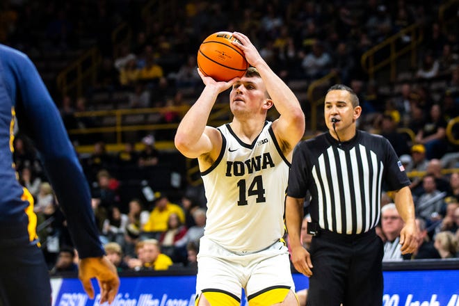 Iowa guard Carter Kingsbury (14) shoots 3-point basket during a NCAA men's basketball game against North Carolina A&T, Friday, Nov. 11, 2022, at Carver-Hawkeye Arena in Iowa City, Iowa.