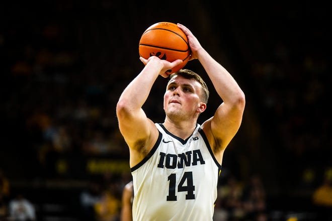 Iowa guard Carter Kingsbury (14) shoots a free throw during a NCAA men's basketball game against North Carolina A&T, Friday, Nov. 11, 2022, at Carver-Hawkeye Arena in Iowa City, Iowa.