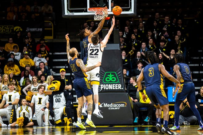 Iowa forward Patrick McCaffery (22) shoots a basket as North Carolina A&T forwards Duncan Powell, left, and Austin Johnson defend during a NCAA men's basketball game, Friday, Nov. 11, 2022, at Carver-Hawkeye Arena in Iowa City, Iowa.