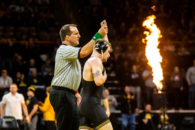 Iowa's Brody Teske has his hand raised after scoring a decision at 133 pounds against California Baptist's Hunter Leake during a NCAA wrestling dual, Sunday, Nov. 13, 2022, at Carver-Hawkeye Arena in Iowa City, Iowa.
