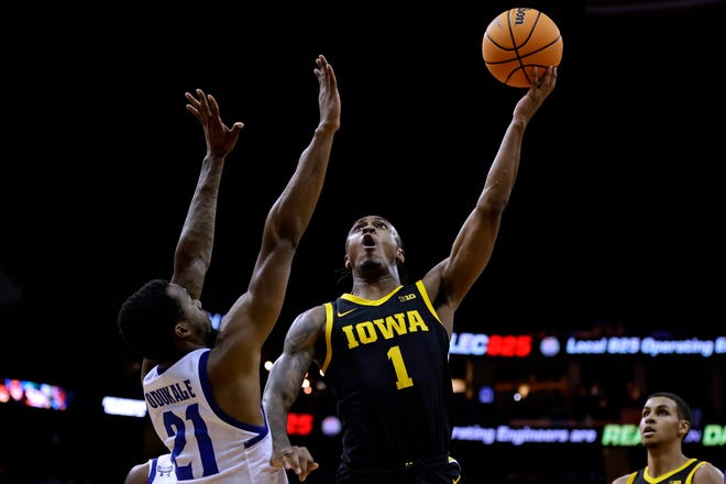 Iowa guard Ahron Ulis (1) shoots against Seton Hall guard Femi Odukale during the first half of an NCAA college basketball game, Wednesday, Nov. 16, 2022, at the Prudential Center in Newark, N.J.