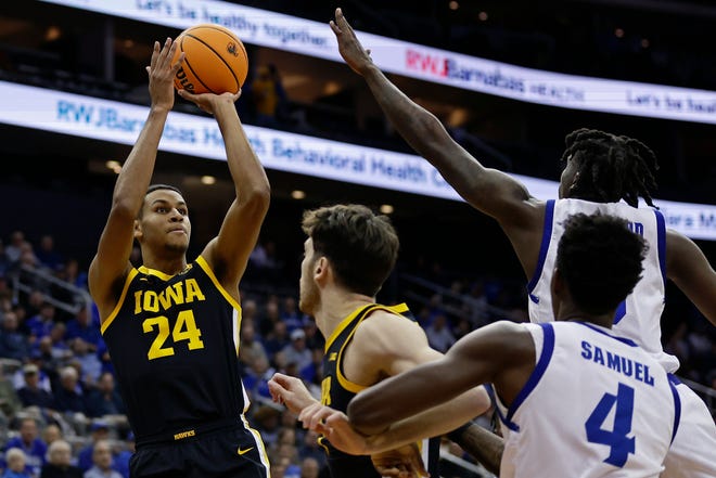 Iowa forward Kris Murray (24) shoots against Seton Hall during the first half of an NCAA college basketball game, Wednesday, Nov. 16, 2022, at the Prudential Center in Newark, N.J.