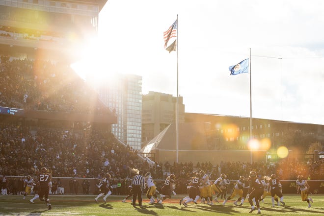 The sun beams into the stadium as the Iowa Hawkeyes offense runs a play against the Minnesota Golden Gophers, Saturday, Nov. 19, 2022, at Huntington Bank Stadium in Minneapolis, Minn.