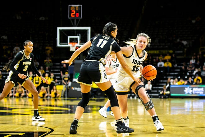 Iowa forward Shateah Wetering, right, drives to the basket as Purdue guard Lasha Petree (11) defends during a NCAA Big Ten Conference women's basketball game, Thursday, Dec. 29, 2022, at Carver-Hawkeye Arena in Iowa City, Iowa.