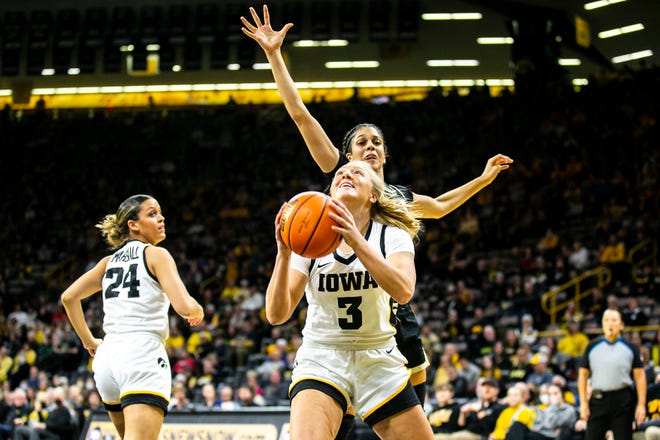 Iowa guard Sydney Affolter (3) shoots the ball as Purdue guard Lasha Petree defends during a NCAA Big Ten Conference women's basketball game, Thursday, Dec. 29, 2022, at Carver-Hawkeye Arena in Iowa City, Iowa.