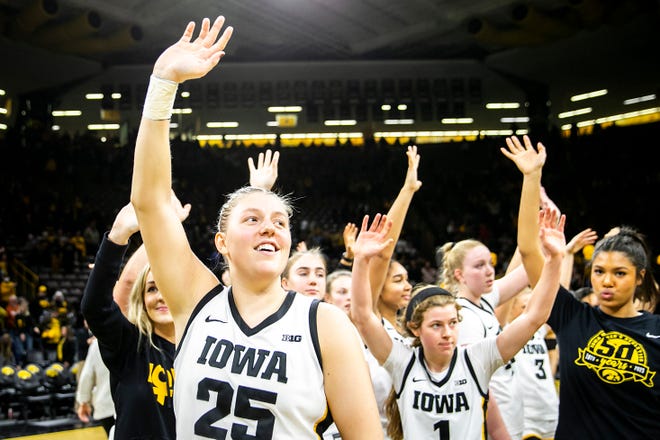 Iowa center Monika Czinano (25) waves to fans after a NCAA Big Ten Conference women's basketball game against Purdue, Thursday, Dec. 29, 2022, at Carver-Hawkeye Arena in Iowa City, Iowa. Iowa won, 83-68.