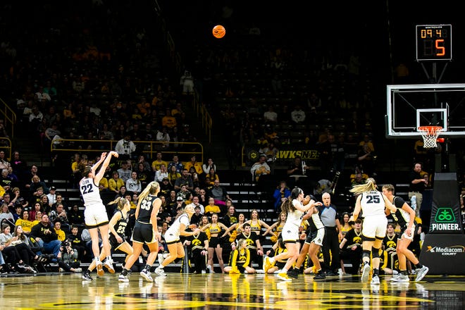 Iowa guard Caitlin Clark (22) makes a 3-point basket during a NCAA Big Ten Conference women's basketball game against Purdue, Thursday, Dec. 29, 2022, at Carver-Hawkeye Arena in Iowa City, Iowa.