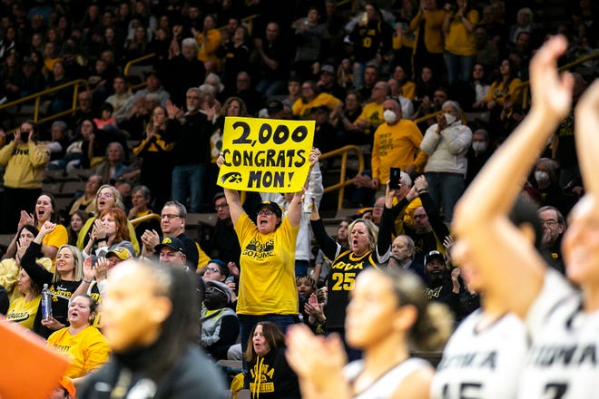 Iowa fans cheer after Monika Czinano (not pictured) surpassed career 2,000 points during a NCAA Big Ten Conference women's basketball game against Purdue, Thursday, Dec. 29, 2022, at Carver-Hawkeye Arena in Iowa City, Iowa.