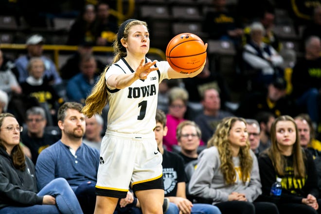 Iowa guard Molly Davis (1) inbounds the ball during a NCAA Big Ten Conference women's basketball game against Purdue, Thursday, Dec. 29, 2022, at Carver-Hawkeye Arena in Iowa City, Iowa.