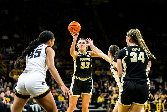 Purdue guard Madison Layden (33) shoots a basket as Iowa guard Caitlin Clark defends during a NCAA Big Ten Conference women's basketball game, Thursday, Dec. 29, 2022, at Carver-Hawkeye Arena in Iowa City, Iowa.