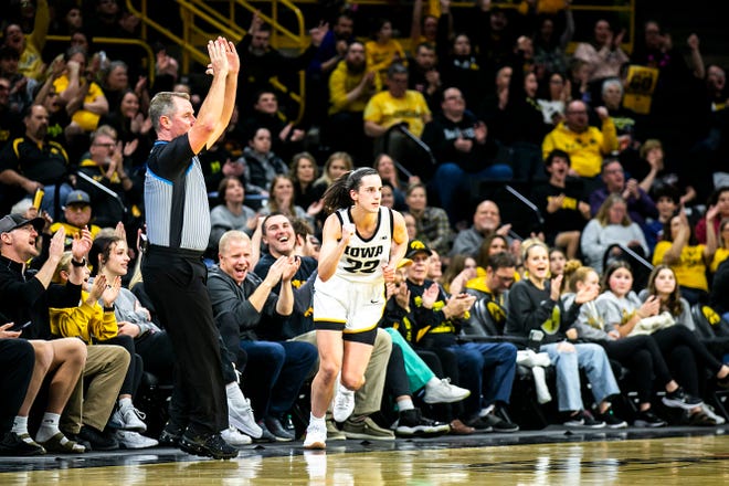 Iowa guard Caitlin Clark (22) reacts after making a 3-point basket during a NCAA Big Ten Conference women's basketball game against Purdue, Thursday, Dec. 29, 2022, at Carver-Hawkeye Arena in Iowa City, Iowa.