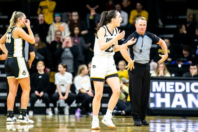 Iowa guard Caitlin Clark (22) reacts after getting called for a foul during a NCAA Big Ten Conference women's basketball game against Purdue, Thursday, Dec. 29, 2022, at Carver-Hawkeye Arena in Iowa City, Iowa.