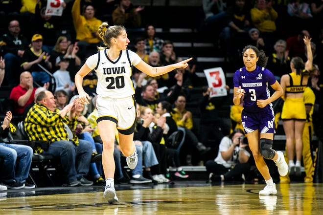Iowa guard Kate Martin (20) reacts after making a 3-point basket during a NCAA Big Ten Conference women's basketball game against Northwestern, Wednesday, Jan. 11, 2023, at Carver-Hawkeye Arena in Iowa City, Iowa.