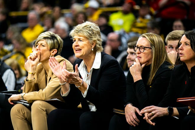 Iowa head coach Lisa Bluder, second from left, cheers during a NCAA Big Ten Conference women's basketball game against Northwestern, Wednesday, Jan. 11, 2023, at Carver-Hawkeye Arena in Iowa City, Iowa.