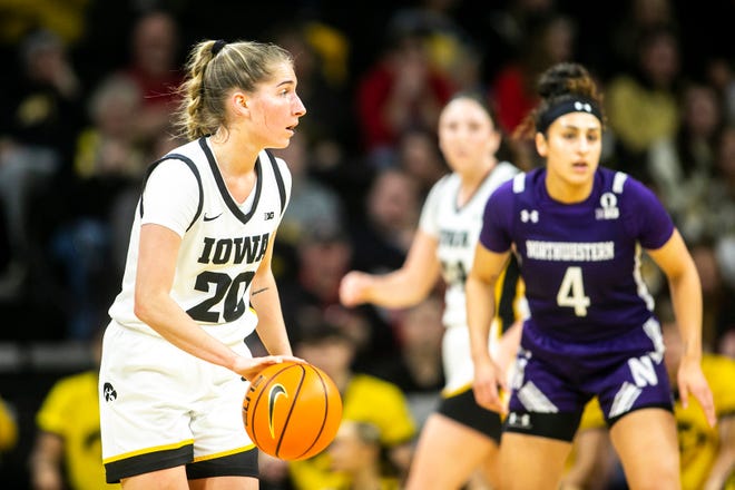 Iowa guard Kate Martin (20) dribbles during a NCAA Big Ten Conference women's basketball game against Northwestern, Wednesday, Jan. 11, 2023, at Carver-Hawkeye Arena in Iowa City, Iowa.