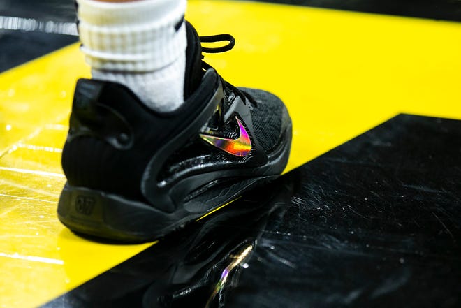 The shoes of Iowa guard Molly Davis are seen during a NCAA Big Ten Conference women's basketball game against Northwestern, Wednesday, Jan. 11, 2023, at Carver-Hawkeye Arena in Iowa City, Iowa.