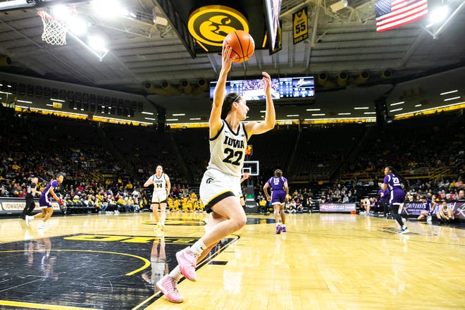 Iowa guard Caitlin Clark (22) pulls down a rebound during a NCAA Big Ten Conference women's basketball game against Northwestern, Wednesday, Jan. 11, 2023, at Carver-Hawkeye Arena in Iowa City, Iowa.