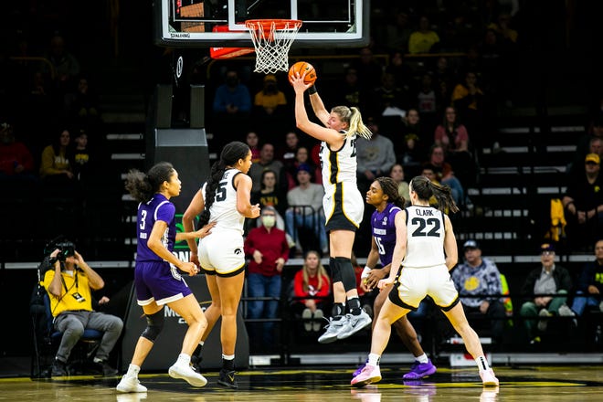 Iowa center Monika Czinano pulls down a rebound during a NCAA Big Ten Conference women's basketball game against Northwestern, Wednesday, Jan. 11, 2023, at Carver-Hawkeye Arena in Iowa City, Iowa.