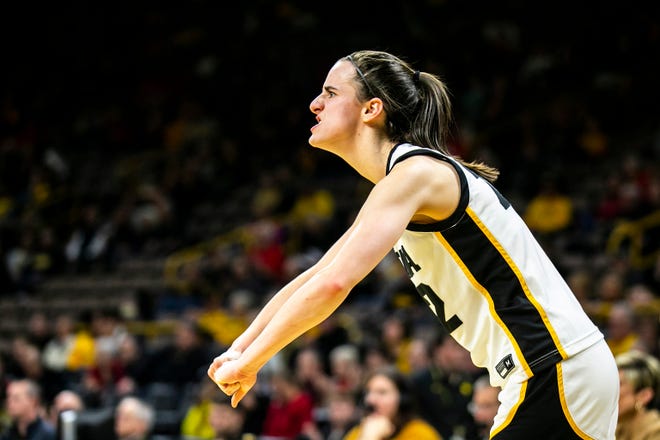 Iowa guard Caitlin Clark cheers on teammates during a NCAA Big Ten Conference women's basketball game against Northwestern, Wednesday, Jan. 11, 2023, at Carver-Hawkeye Arena in Iowa City, Iowa.