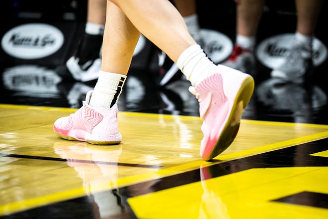 The shoes of Iowa guard Caitlin Clark are seen during a NCAA Big Ten Conference women's basketball game against Northwestern, Wednesday, Jan. 11, 2023, at Carver-Hawkeye Arena in Iowa City, Iowa.